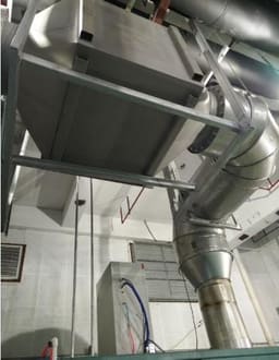 Insulated SCR exhaust line at a combined cooling, heat and power station