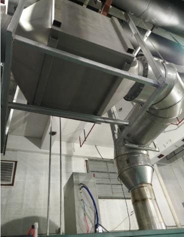 Insulated SCR exhaust line at a combined cooling, heat and power station